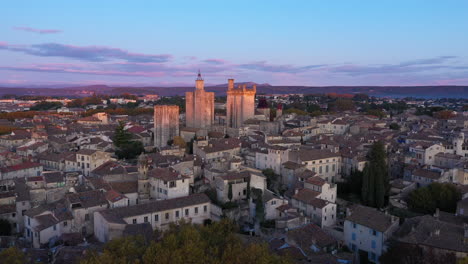 First-sun-lights-early-morning-Uzès-France-aerial-view-historical-village